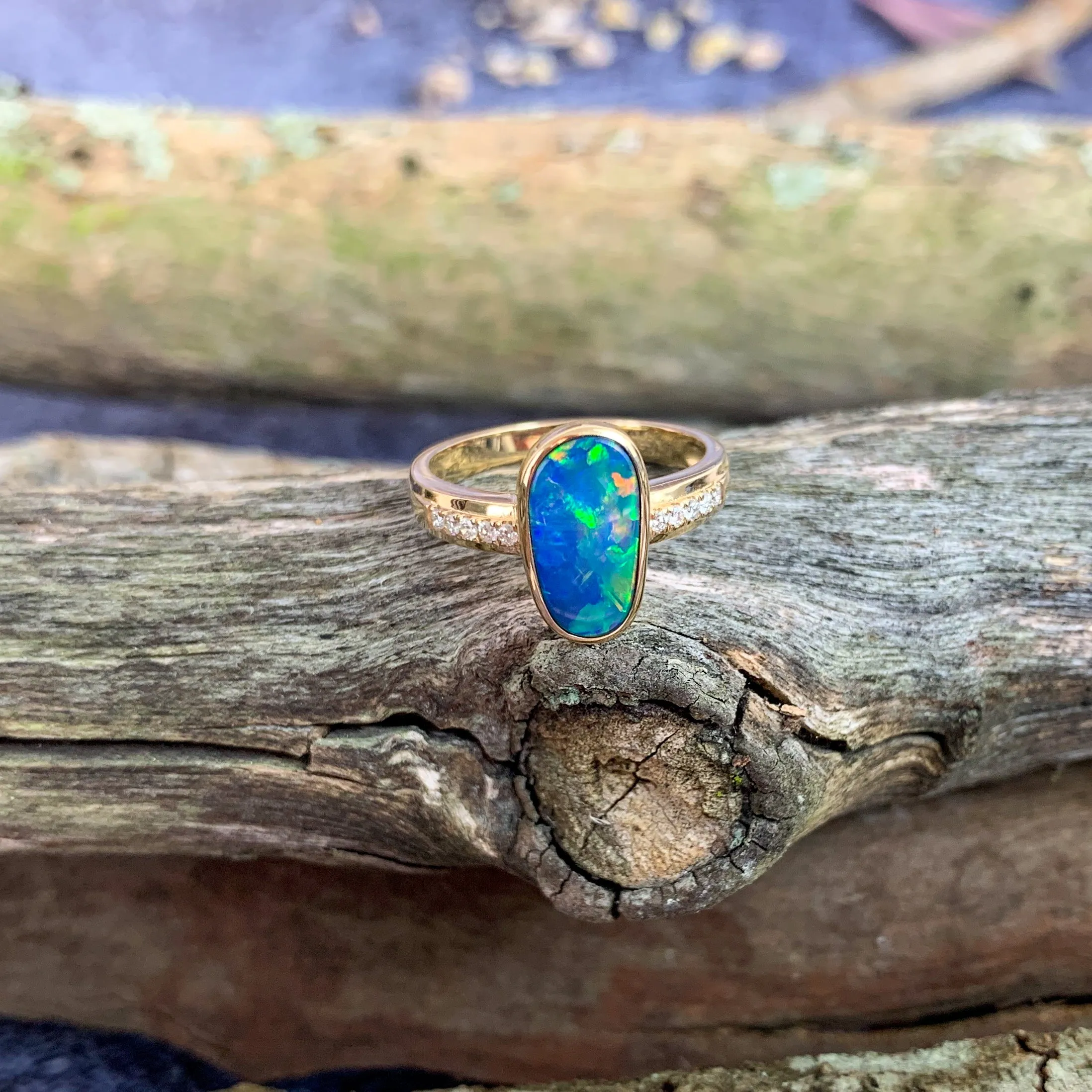 14kt Yellow Gold Oval shaped opal doublet and diamond ring