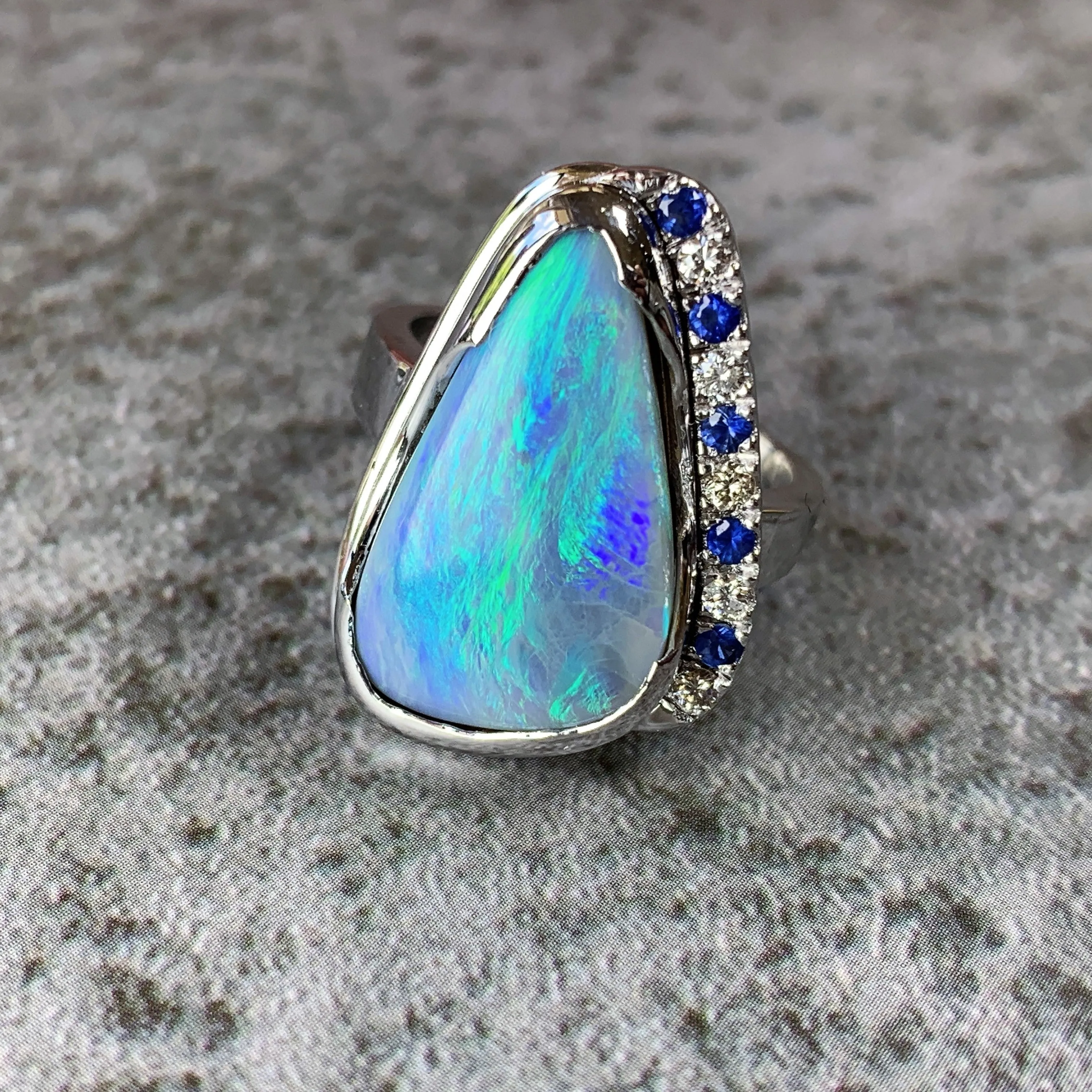 18kt White Gold bezel set Black Opal, Sapphire and Diamond ring