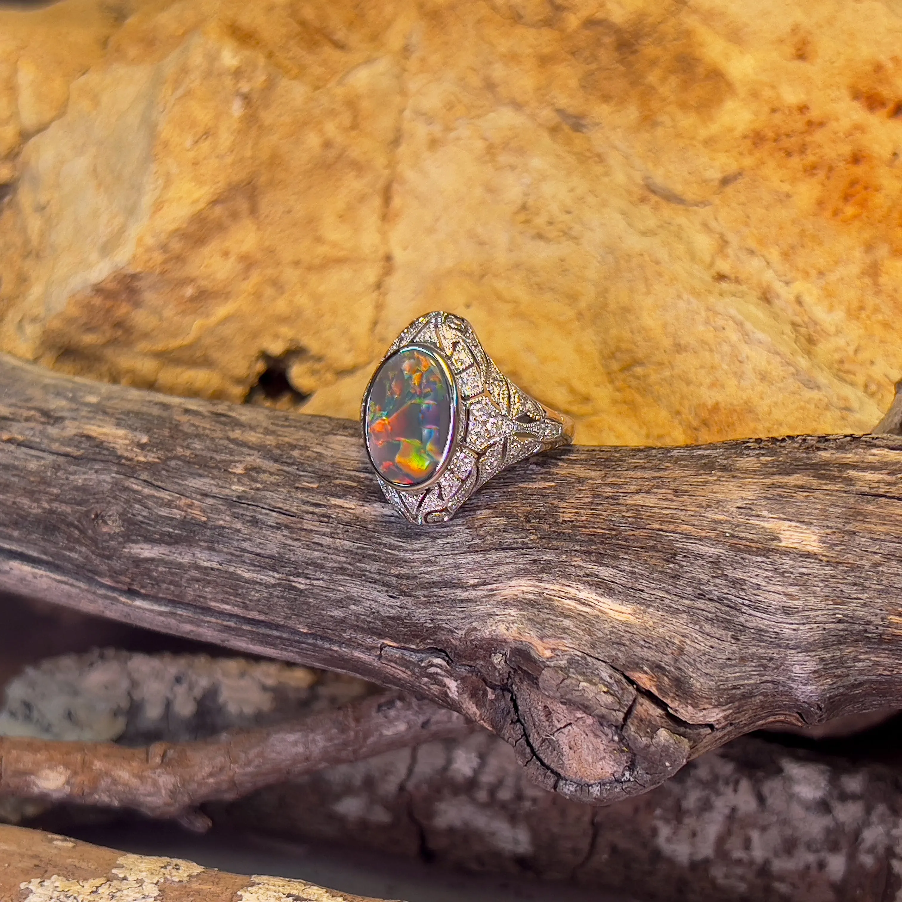 18kt White Gold Black Opal and diamond filligree style ring