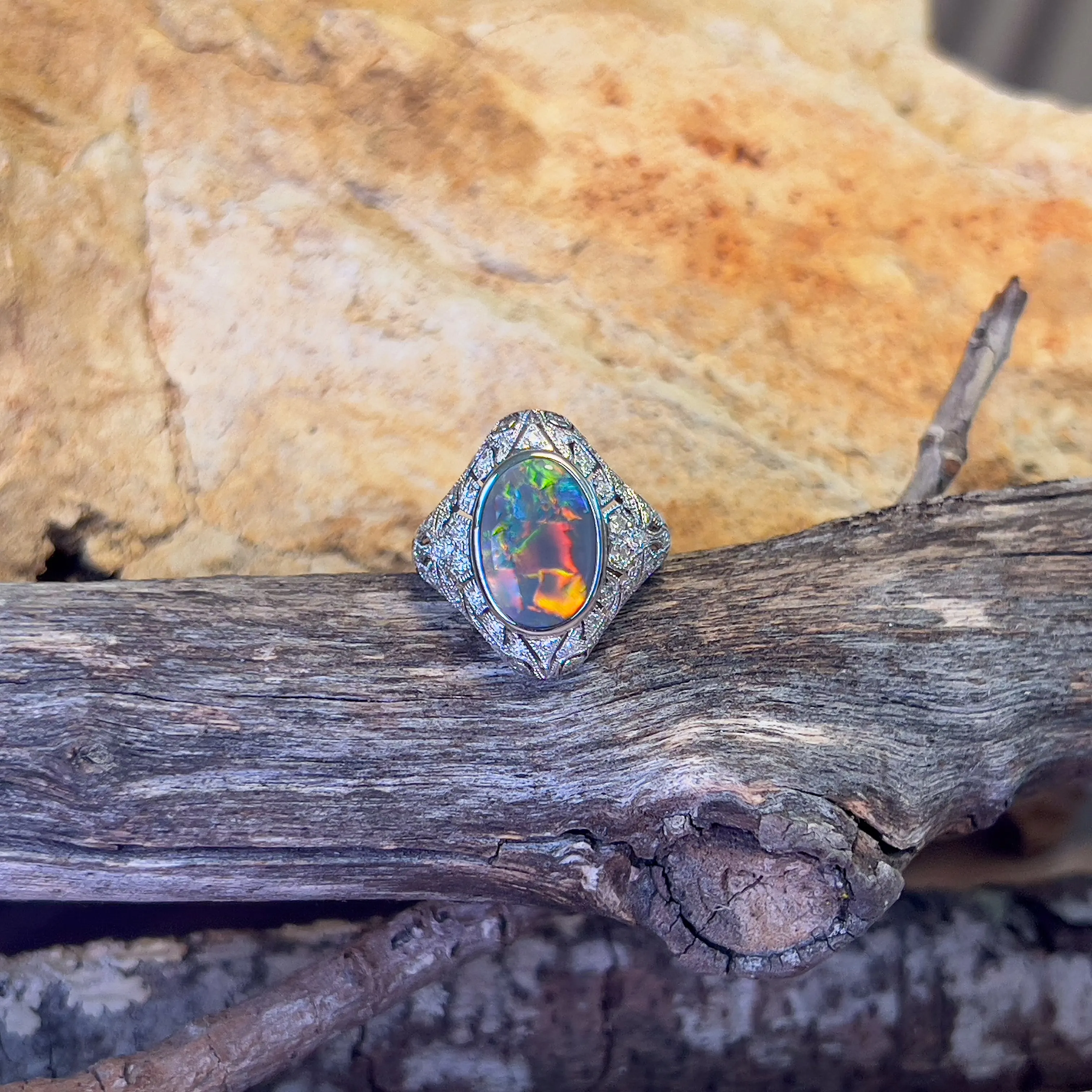 18kt White Gold Black Opal and diamond filligree style ring