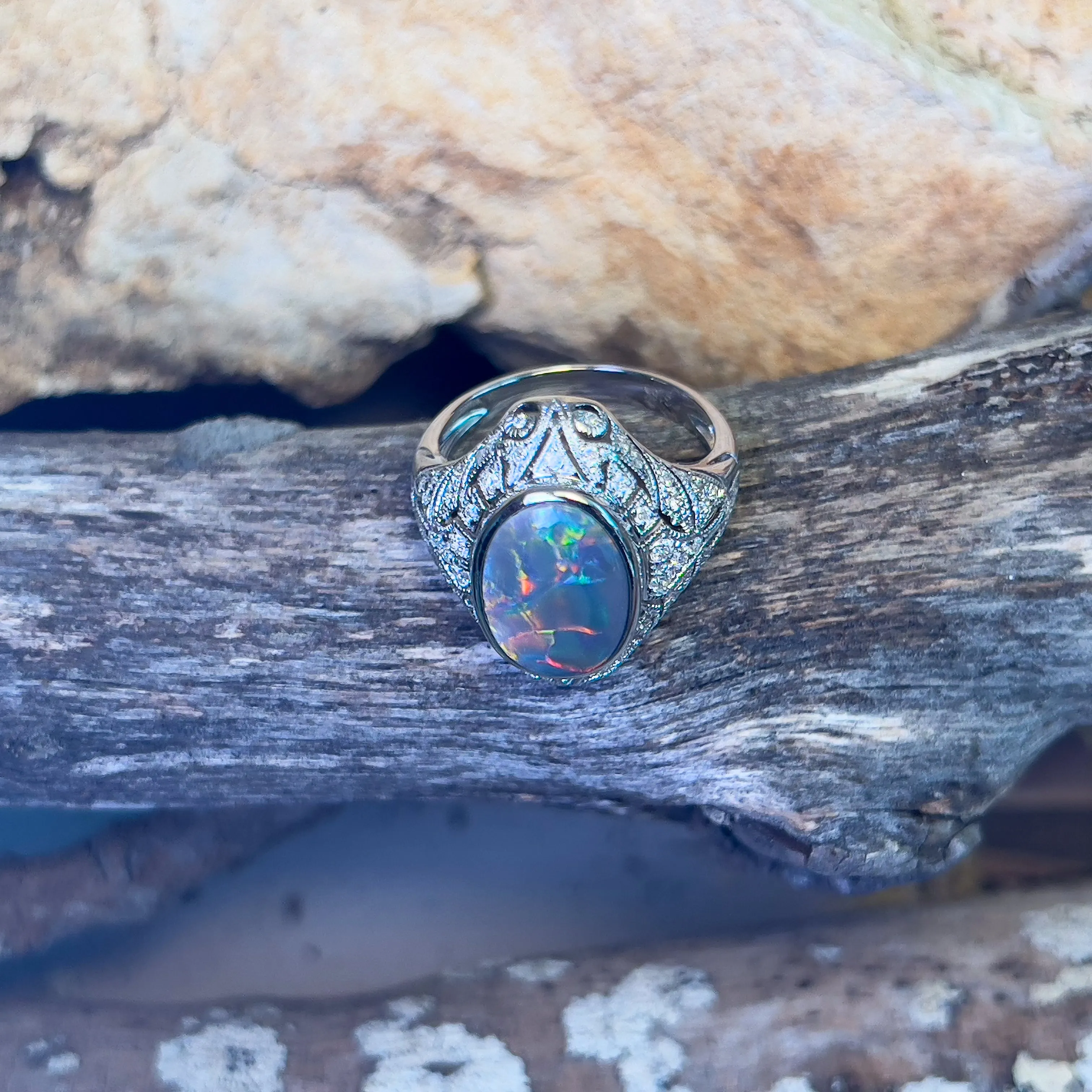 18kt White Gold Black Opal and diamond filligree style ring