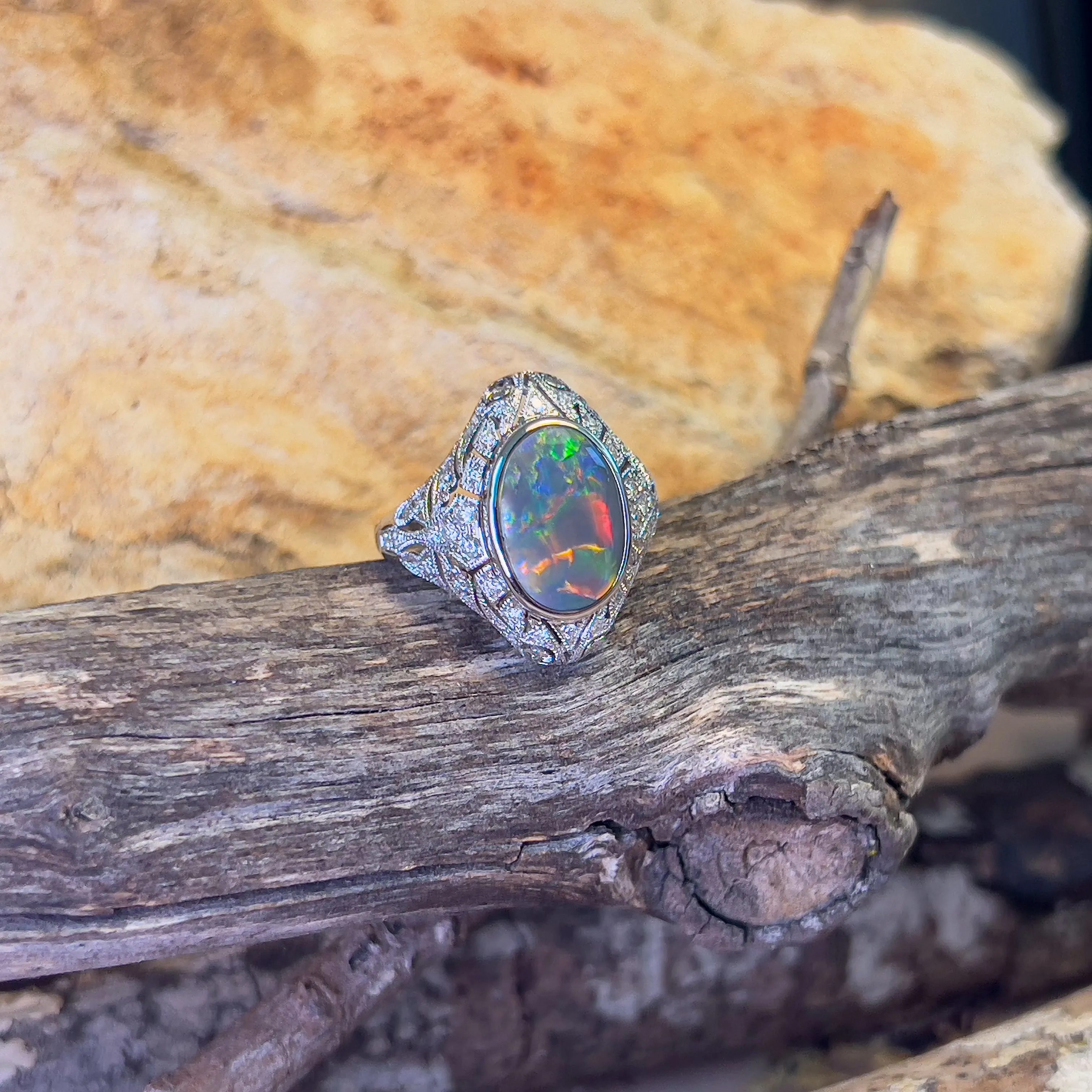 18kt White Gold Black Opal and diamond filligree style ring