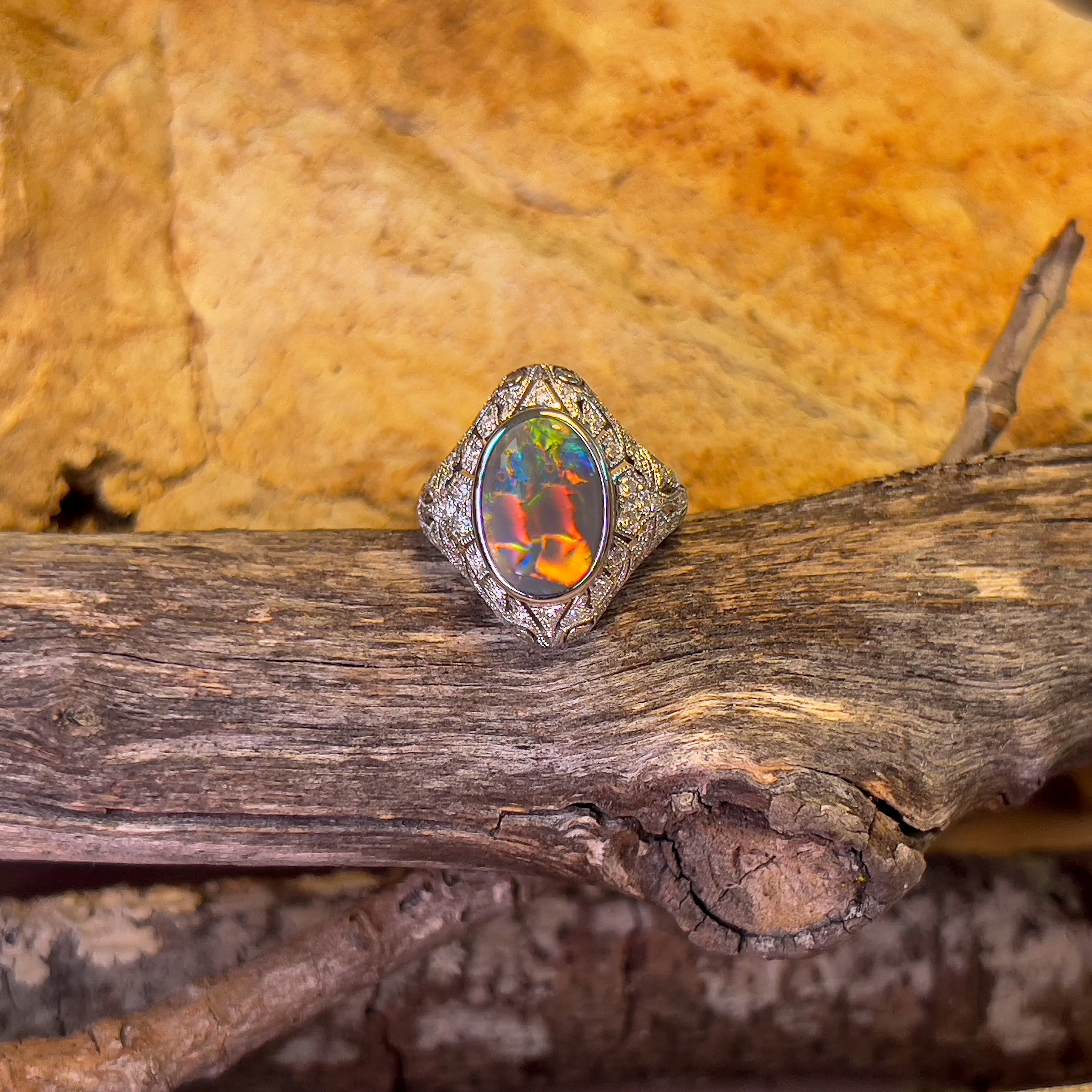 18kt White Gold Black Opal and diamond filligree style ring