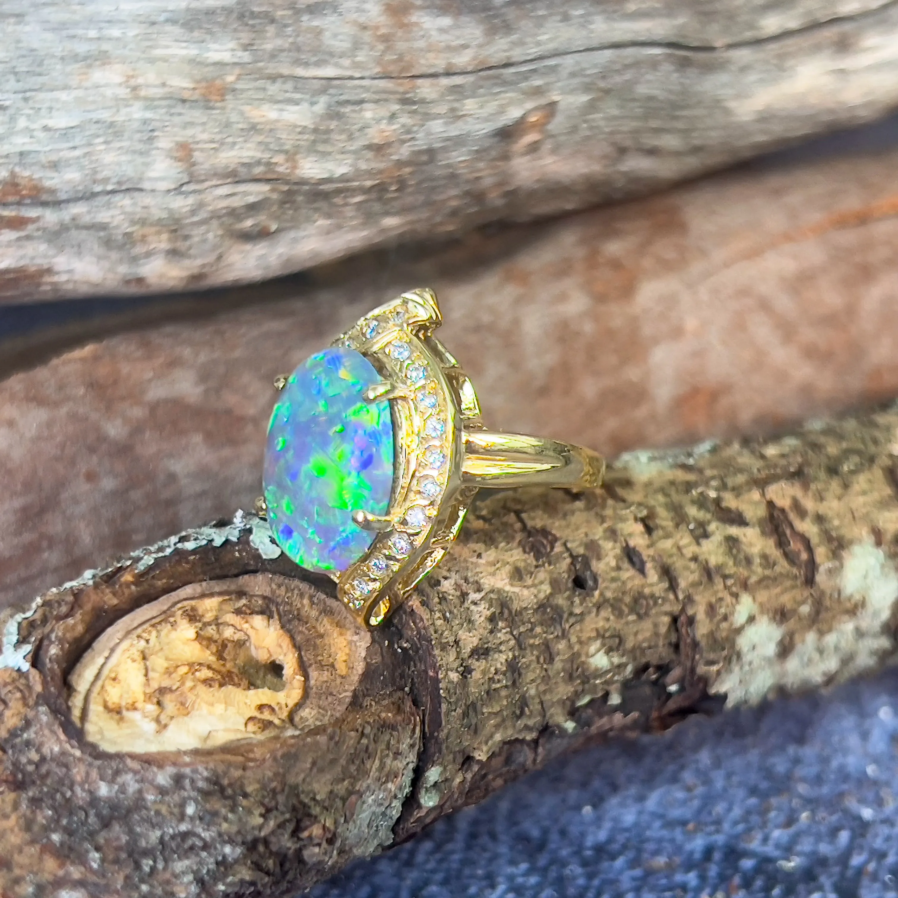 18kt Yellow Gold Black Opal 4ct Green Blue and diamond ring