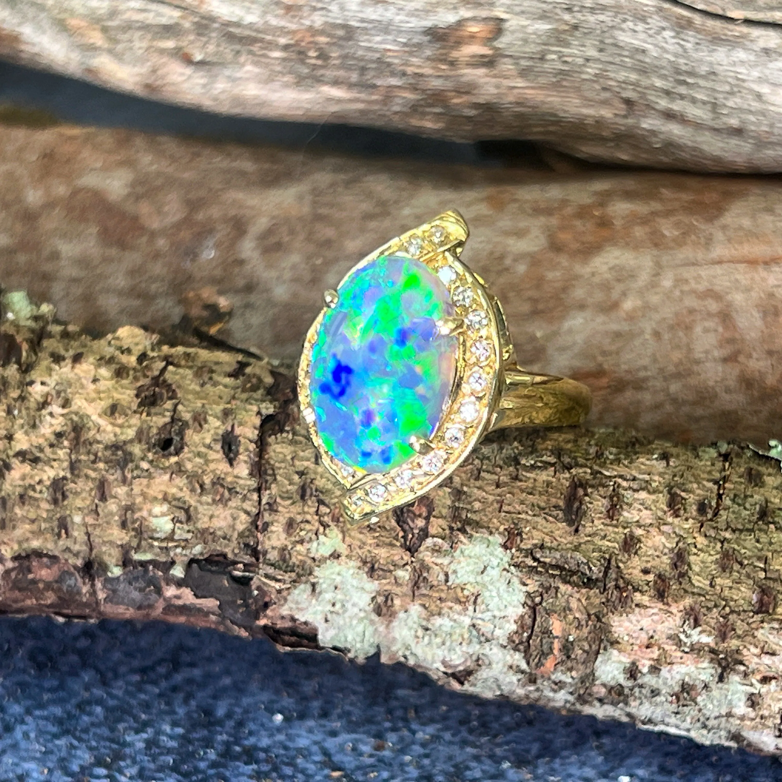 18kt Yellow Gold Black Opal 4ct Green Blue and diamond ring