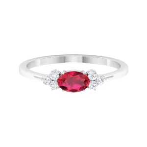 East West Ruby Oval Engagement Ring with Diamond Trio