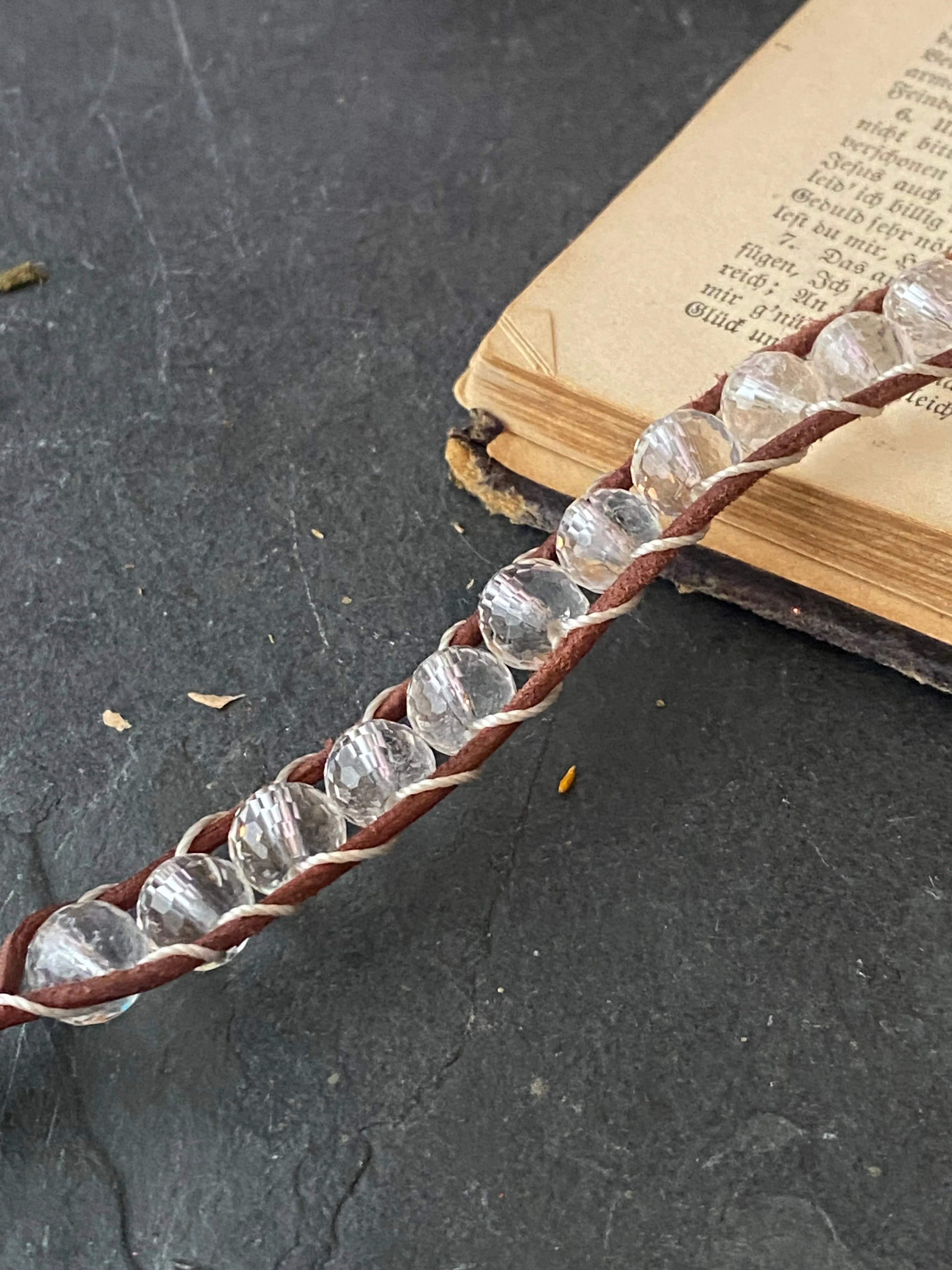 Faceted clear quartz stone, leather ladder bracelet with silver button